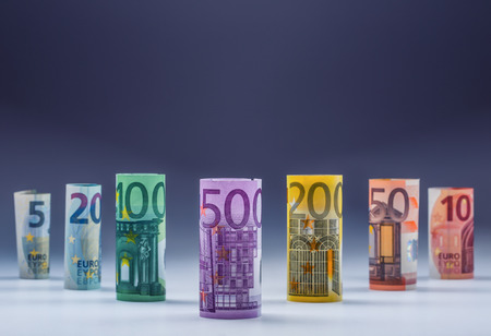 Several hundred euro banknotes stacked by value. Euro money concept. Rolls Euro  banknotes. Euro...