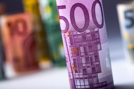 Several hundred euro banknotes stacked by value. Euro money concept. Rolls Euro  banknotes. Euro currency. Announced cancellation of five hundred euro banknotes. Banknotes stacked on each other in different positions. Toned photo.の写真素材