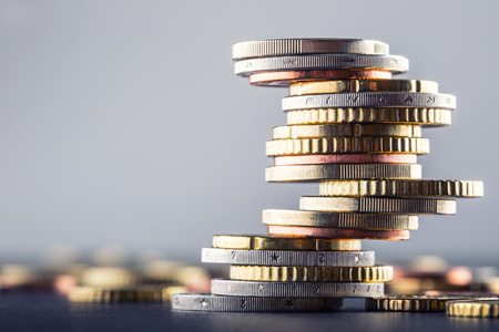 Euro coins. Euro money. Euro currency.Coins stacked on each other in different positions. Money concept.の写真素材