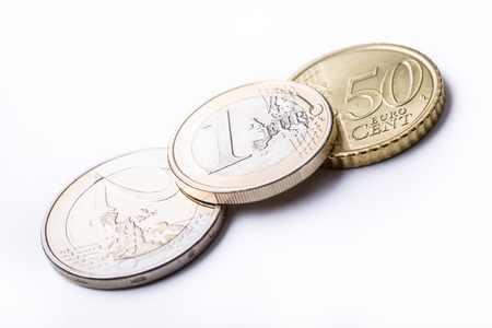 Euro coins. Euro money. Euro currency.Coins stacked on each other in different positions. Money concept.の写真素材