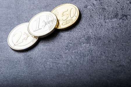 Euro coins. Euro money. Euro currency.Coins stacked on each other in different positions. Money concept.の写真素材