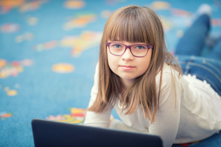 Young of beautiful pre-teen girl with tablet laptop pc. Education technology for teenagers -...