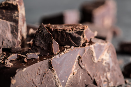 Chocolate. Black chocolate. A few cubes of black chocolate. Chocolate chunks. Chocolate bar pieces.の写真素材
