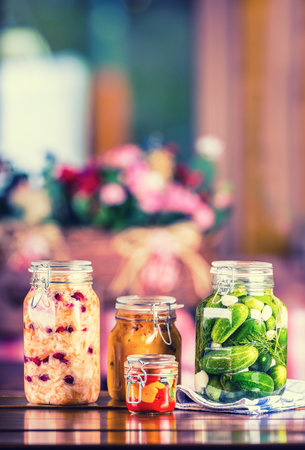 Preserving. Pickles jars. Jars with pickles, pumpkin dip, white cabbage, roasted red yellow pepper....