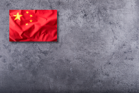 China flag. Peoples Republic of China flag on concrete background.の写真素材