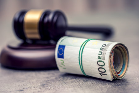Judge's hammer gavel. Justice and euro money. Euro currency. Court gavel and rolled Euro banknotes....