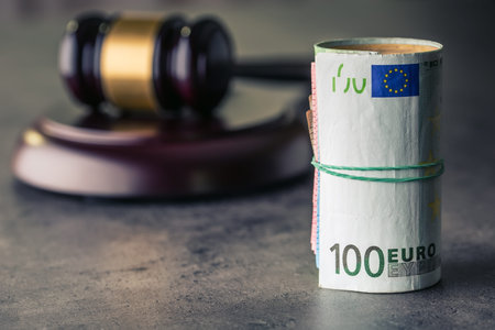 Judge's hammer gavel. Justice and euro money. Euro currency. Court gavel and rolled Euro banknotes....