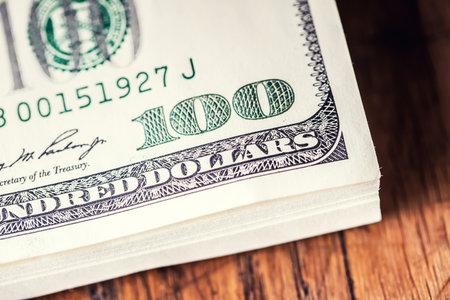 Dollars banknotes closeup. Cash Money American Dollars.Close-up view of stack of US dollars.