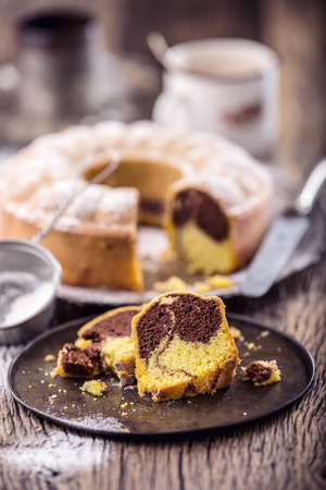 Marble cake.Easter Cake. Marble cake cup of coffee powder sugar and kitchen vintage utensil.の写真素材