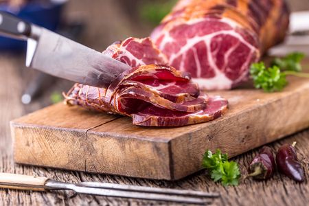 Pork meat.Pork chop smoked. Traditional smoked meat on oak wooden table in other positions.の写真素材