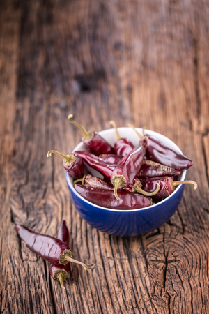 Chili.Red chili peppers on wooden table. Selective focus.の写真素材