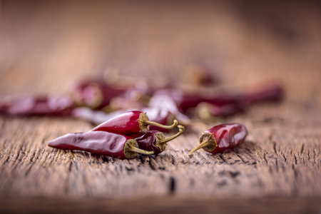 Chili.Red chili peppers on wooden table. Selective focus.