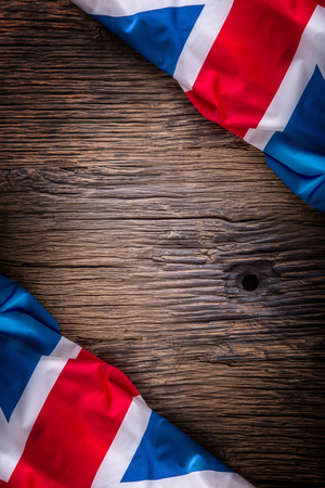 Flag of United Kingdom  on old wooden background. Union Jack  flag on old oak background.の写真素材