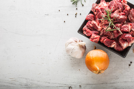 Beef. Raw sliced beef meat garlic onion salt pepper and rosemary.の写真素材