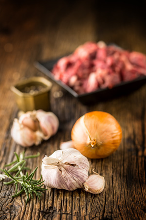 Beef. Raw sliced beef meat garlic onion salt pepper and rosemary.の写真素材