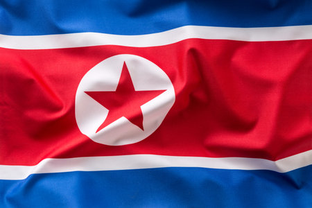 North korea flag. Colorful North Korea flag waving in the wind.