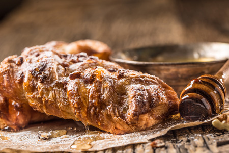 Sweet Pastry. Sweet pie honey cup of coffee on wooden table. Sweet breakfast.の写真素材