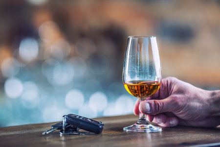Alcoholism. Cup cognac or brandy hand man the keys to the car and irresponsible driver.