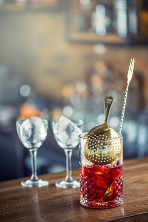 Manhattan cocktail drink decorated on bar counter in pub or restaurant.の写真素材