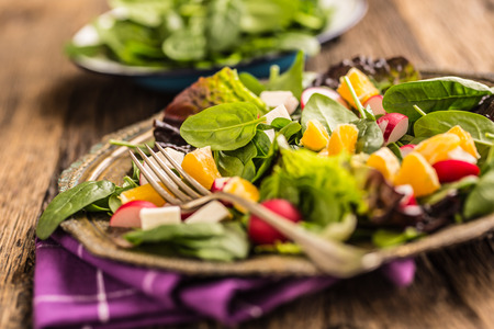 Spinach Salad. Fresh spinach salad with fruit and vegetable.の写真素材