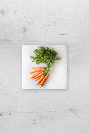 Top of view  fresh carrot on white concrete background.の写真素材