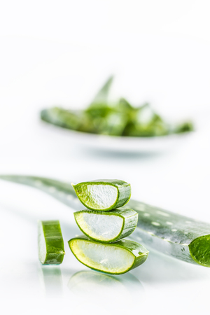 Slices of aloe vera with gel on white background.の写真素材