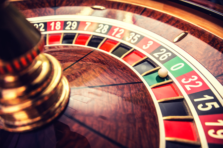 Roulette wheel in casino with ball on green position zero.の写真素材