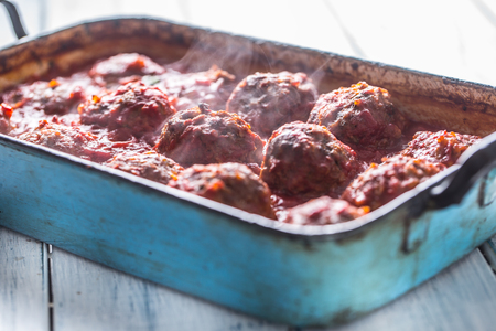 Delisious italian meal meat beef balls with basil in vintage roaster pan.の写真素材
