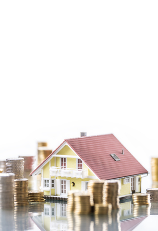 Model familly house with coins as bank or insurance concept.の写真素材