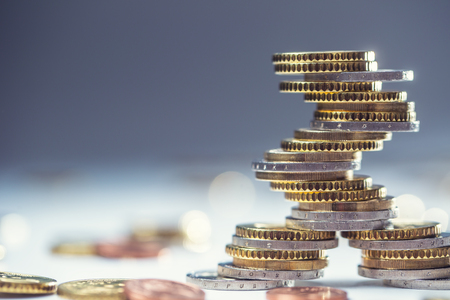 Euro coins stacked on each other in different positions. Close-up european money and currency.の写真素材