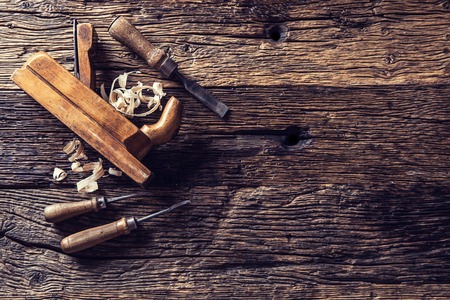 Top of view old planer and other vintage carpenter tools in a carpentry workshop.の写真素材