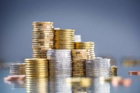 Towers of the euro coins stacked in different positions.の写真素材