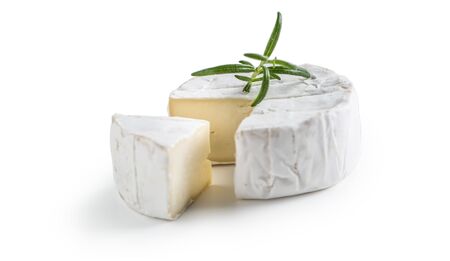 Camembert or brie cheese with rosemary isolated on white.の写真素材