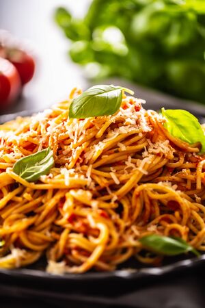 Pasta spaghetti toamto and bolognese sauce with oilve oil parmesan and basil.の写真素材