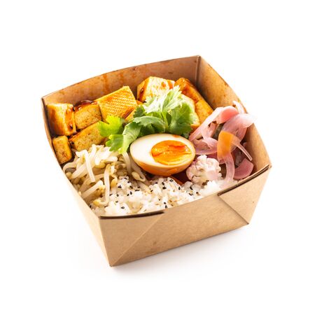 Japanese asian meal in a box of recycled paper isolated on white background. Concept of organic food packaging.の写真素材