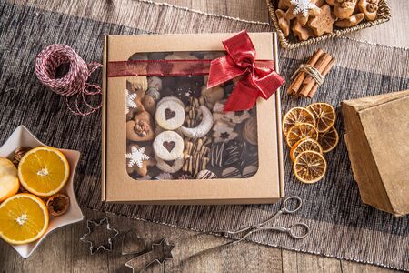 Box full of christmas sweet cokies and pastry with red ribbon.の写真素材