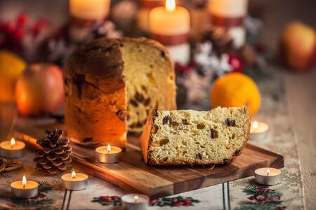 Delicious panettone on christmas table wit decorations and advent wreath and candles.の写真素材