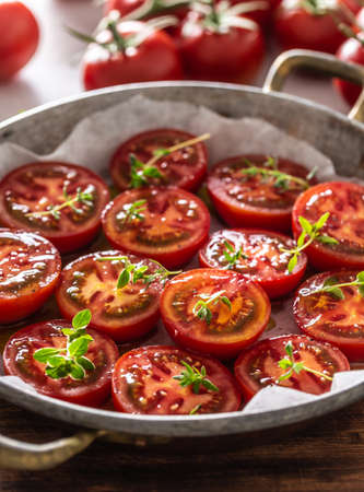 Fresh tomatoes in pan ready to dry or roasted.の写真素材