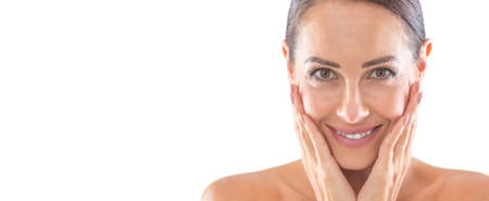 Beautiful portrait of young adult woman with clean skin without make-up. Spa skincare wellness and cosmetics concept.の写真素材