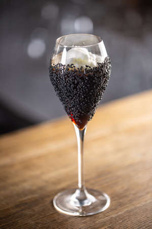 Creative mixology cocktail served in a champaign glass.の写真素材