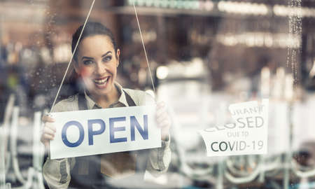 Employee happy to be back at work as restaurant reopens after closure due to covid-19.
