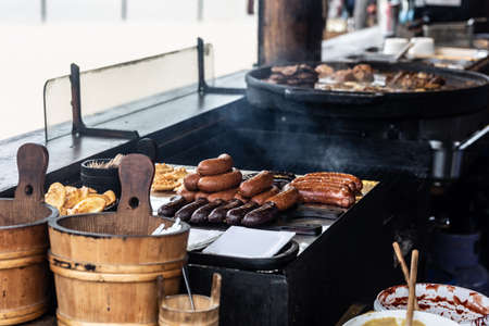 Various fried and grilled meat and cheese served in a traditional restaurant directly from the hot...
