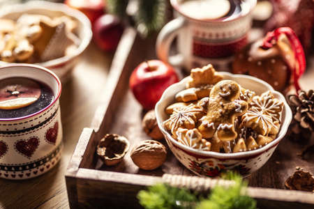 A bowl full of Christmas gingerbread along with hot punch.の写真素材