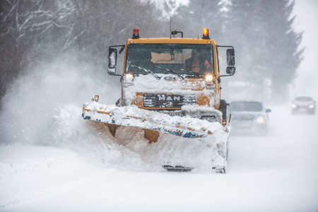 Liptov, Slovakia - JANUARY 30, 2022. The snow plow clears the way for the cars behind it.のeditorial素材