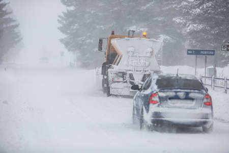 Liptov, Slovakia - JANUARY 30, 2022. The snow plow clears the way for the cars behind it.のeditorial素材