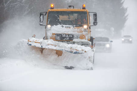 Liptov, Slovakia - JANUARY 30, 2022. The snow plow clears the way for the cars behind it.のeditorial素材