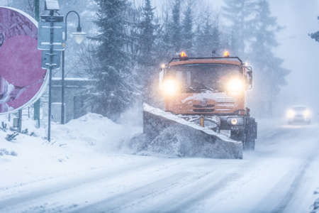 Liptov, Slovakia - JANUARY 30, 2022. The snow plow clears the way for the cars behind it.のeditorial素材
