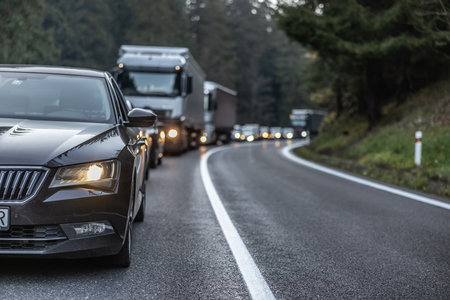 Traffic jam on a mountain road after several vehicles collided in front.