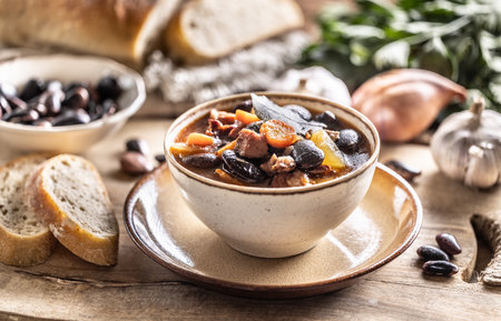 Traditional bean soup made from big beans, smoked neck, potatoes, and carrots.の写真素材