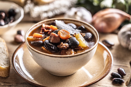 Traditional bean soup made from big beans, smoked neck, potatoes, and carrots.の写真素材
